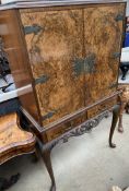 A 20th century walnut drinks cabinet,