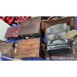A doctors bag together with other leather bags, suitcases,