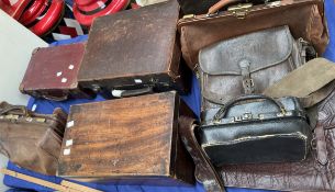 A doctors bag together with other leather bags, suitcases,