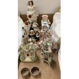 Staffordshire spill vases, together with a Staffordshire figure, continental figures,