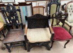 A carved oak X framed elbow chair together with two other carved oak dining chairs,