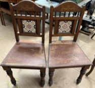 A pair of Victorian tiled back hall chairs