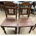 A pair of Victorian tiled back hall chairs