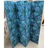 A 20th century four fold screen decorated with William Morris type fabric