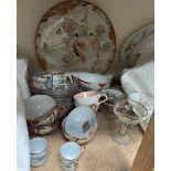 A Japanese satsuma pottery charger together with part tea sets,