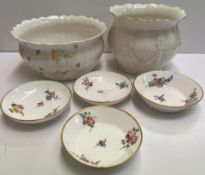 Two Belleek porcelain jardinieres together with four continental porcelain dishes decorated with