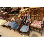 A set of four oak dining chairs with spindle backs together with seven other assorted chairs