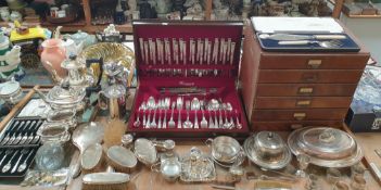 A silver backed part dressing table set together with a silver tea strainer and base and assorted