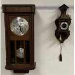 An oak cased wall clock of rectangular form with a silvered dial and Arabic numerals together with