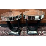 A pair of mirrored side tables of circular form,