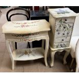 A cream painted and floral decorated side table with a single drawer and a shelf together with a