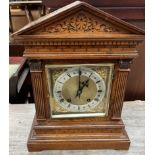 An oak bracket clock,