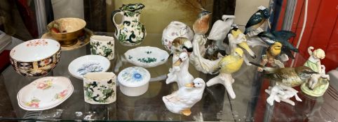 A Royal Worcester figure Springtime together with a collection of bird figures,