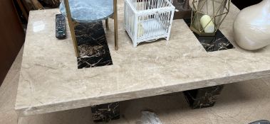 A reconstituted marble up coffee table of rectangular form