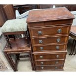 A 20th century mahogany chest on chest together with a stool and a nest of two faux bamboo tables