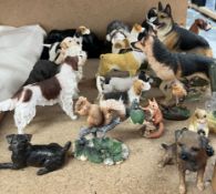 A collection of resin dog and bird figures etc