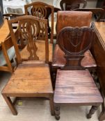 A Victorian mahogany hall chair with a heart shaped back and solid seat on turned front legs