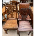 A Victorian mahogany hall chair with a heart shaped back and solid seat on turned front legs