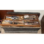 A woodworking tool chest together with a large quantity of woodworking tools