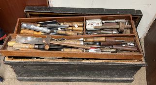 A woodworking tool chest together with a large quantity of woodworking tools