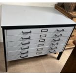 A modern folio cabinet, with a rectangular top and six graduated drawers 100.