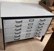 A modern folio cabinet, with a rectangular top and six graduated drawers 100.