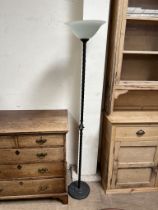A 20th century uplighter with a domed glass shade and a twisted iron column and spreading foot