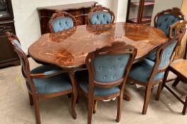 A modern inlaid dining table together with a set of six dining chairs and a sideboard