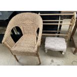 A wicker elbow chair together with a towel rail and an upholstered footstool