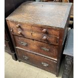 A 19th century oak bureau with a sloping fall and three drawers