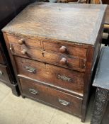 A 19th century oak bureau with a sloping fall and three drawers