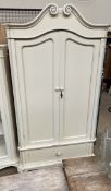 A continental cream painted armoire,