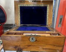 A Victorian walnut laptop desk, with a sloping writing surface,