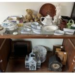 A Victorian walnut laptop desk together with a mantle clock, photograph frames,