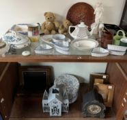 A Victorian walnut laptop desk together with a mantle clock, photograph frames,