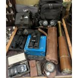 A brass and leather covered three drawer telescope together with binoculars, Binomag,