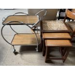 A mid 20th century teak and tiled top nest of three tables together with a chrome and melamine tea