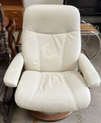 A cream leather reclining chair on a circular base