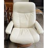 A cream leather reclining chair on a circular base