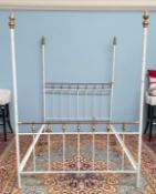 A white painted brass and iron double bed