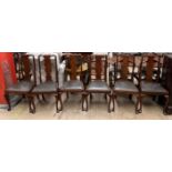 A set of six Queen Anne style mahogany dining chairs with a vase splat and drop in seats on