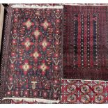 A red ground rug with three rows of stylised guls, and multiple guard stripes,