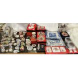 A collection of Royal Crown Derby paperweights together with assorted porcelain boxes and covers,