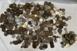 A large collection of coins including Pennies, Two Shillings,