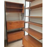A pair of mid 20th century Interflex teak bookcases, one with a bureau and base cupboards,