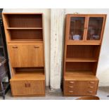 A G-Plan teak wall unit with central drinks cabinet,