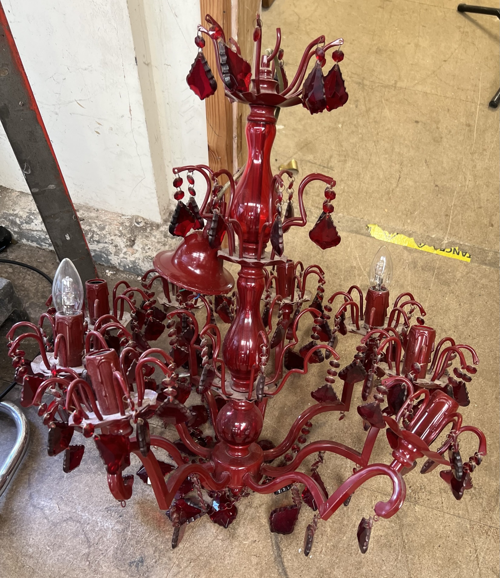 A red glass two tier lustre drop chandelier