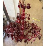 A red glass two tier lustre drop chandelier