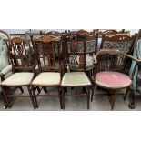 An Edwardian mahogany oval elbow chair together with a pair of Edwardian salon chairs and another