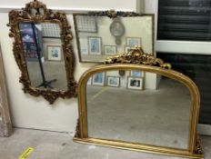 A gilt decorated overmantle mirror together with two other wall mirrors